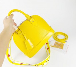 Louis Vuitton Epi Leather Alma BB Handbag In Cedrat Yellow With Jacquard Strap