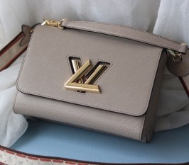 Louis Vuitton Epi Leather Twist MM Handbag In Galet Gray With Embroidered Strap