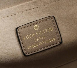 Louis Vuitton Monogram Empreinte Leather Montaigne MM Handbag In Tourterelle Gray