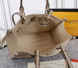Louis Vuitton Monogram Empreinte Leather OnTheGo MM Tote In Tourterelle Gray