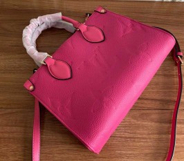 Louis Vuitton Monogram Empreinte Leather Onthego PM Bag In Freesia Pink